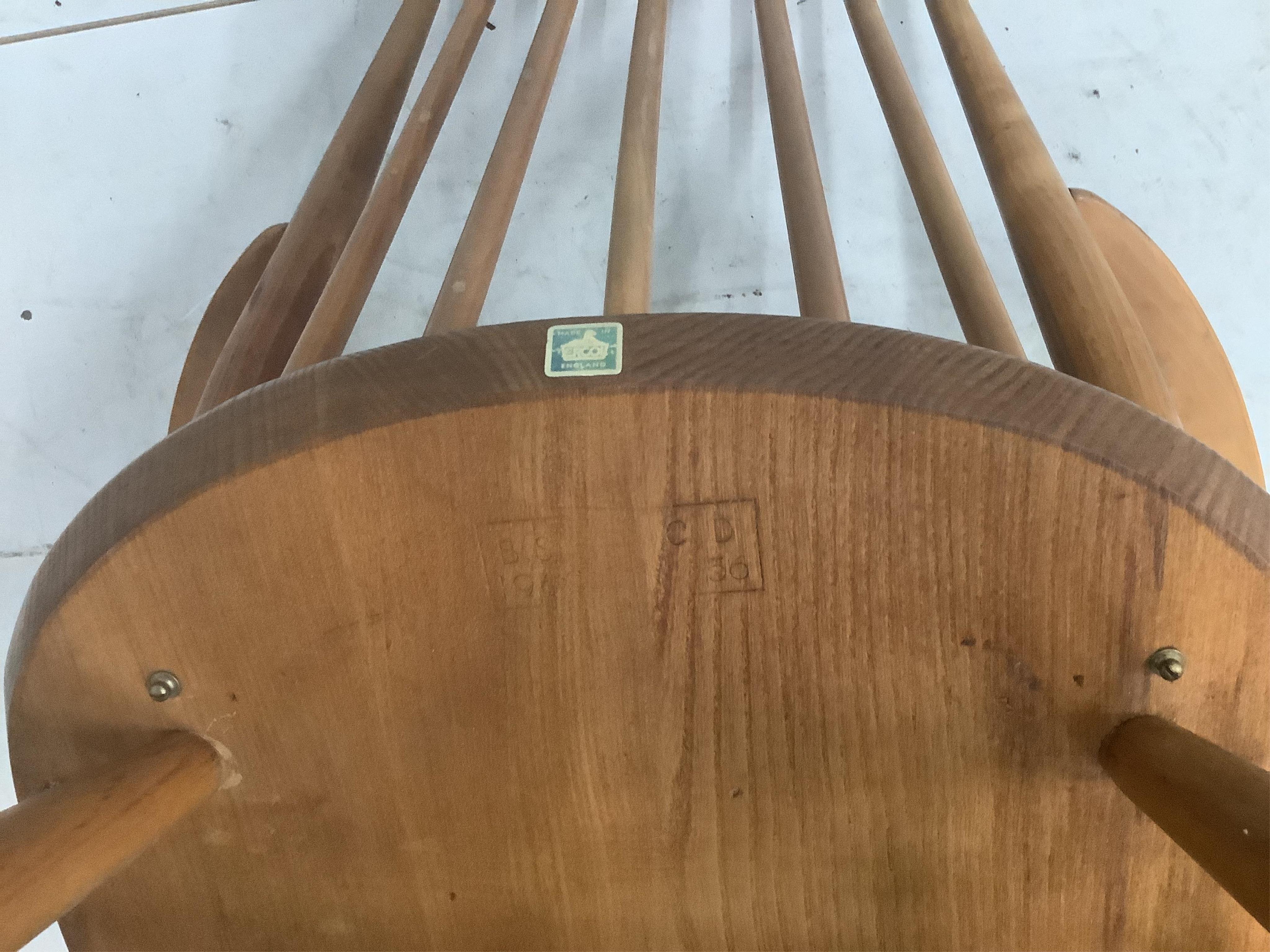 An Ercol Goldsmith's comb back elbow chair, width 61cm, depth 41cm, height 98cm. Condition - fair